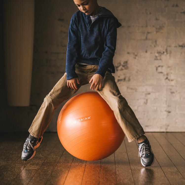 playing on the kids 45 cm balance ball